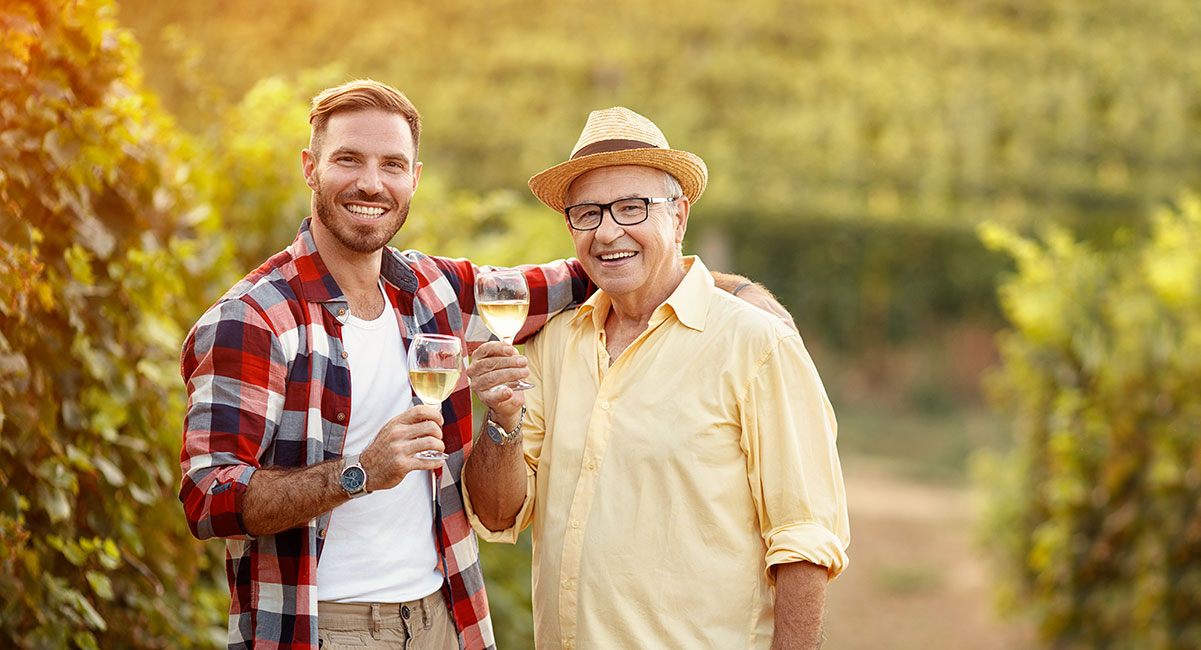 man and his dad toasting with wine